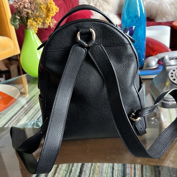 black and coral north face backpack Women's The Recon Luxe TNF / Burnt Yoobi Mini Backpack Pencil Color:Gosthly Floral Pattern_Animal while a large main